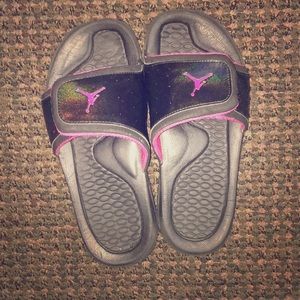 Black and pink Jordan slides